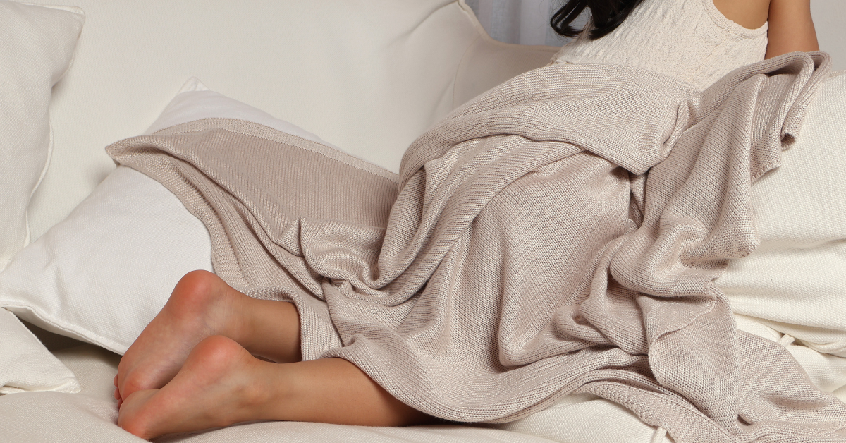 Bamboo fibre blankets draping comfortably over a girl.